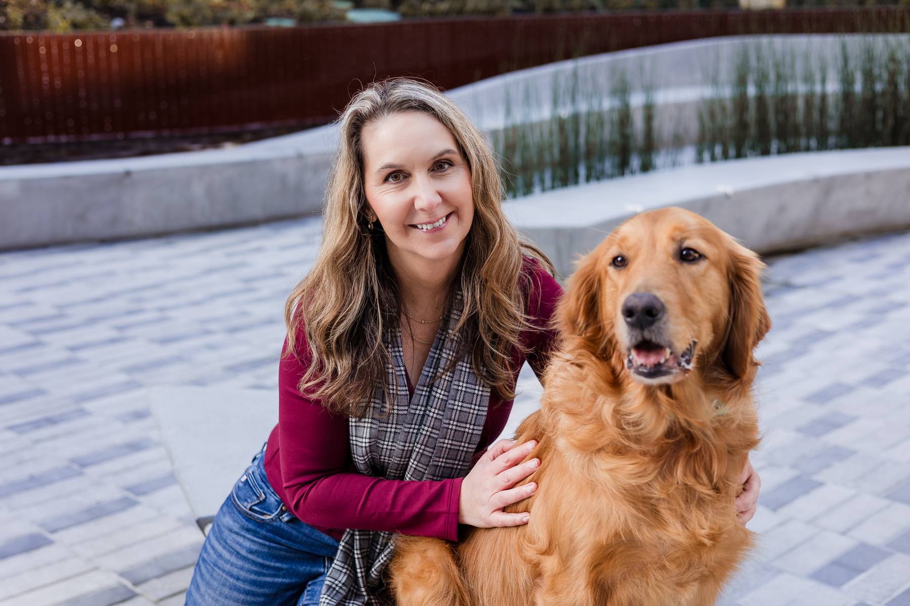 Trina, outdoors with her golden retriever